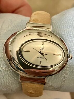 B YOU Stainless Steel wristwatch with tan leather band. Unisex. Hinge style
